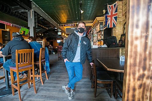 MIKAELA MACKENZIE / WINNIPEG FREE PRESS

Hughie Glover, a bartender at the King's Head who is getting the vaccine because the restaurant he works at is in a hot zone, poses for a portrait at the pub in Winnipeg on Friday, April 23, 2021. For Kevin story.
Winnipeg Free Press 2020.