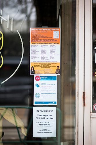 MIKAELA MACKENZIE / WINNIPEG FREE PRESS

Posters advertising vaccine eligibility in West Broadway in Winnipeg on Monday, April 26, 2021. For Cody story.
Winnipeg Free Press 2020.