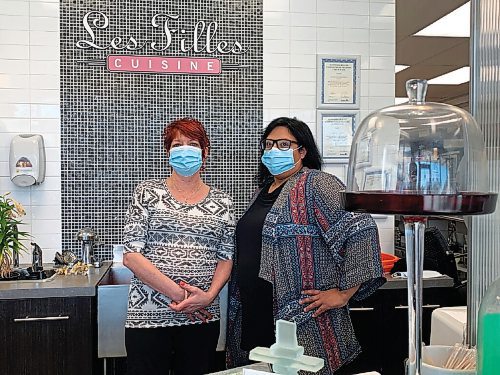 Canstar Community News Les Filles Cuisine co-owners Michelle Walker (left) and Denys Curle are shown inside their St. Vital business.