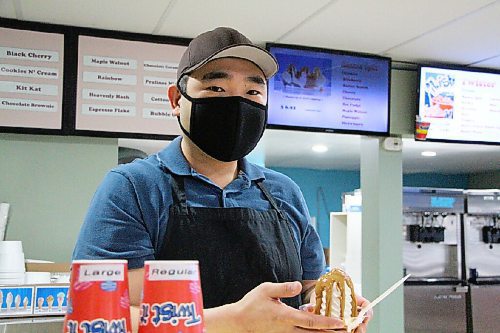 Canstar Community News Heuitai Lee holds a peanut butter sundae at E's Ice Cream on April 19. (GABRIELLE PICHÉ/CANSTAR COMMUNITY NEWS/HEADLINER)