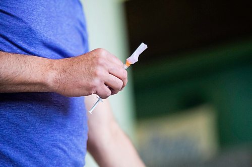 MIKAELA MACKENZIE / WINNIPEG FREE PRESS

Dr. Barry Lavallee, CEO of Keewatinohk Inniniw Minoayawin, holds a needle with the vaccine at the Aboriginal Health and Wellness Centre Indigenous immunization clinic in Winnipeg on Thursday, April 29, 2021.
Winnipeg Free Press 2020.