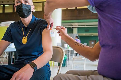 MIKAELA MACKENZIE / WINNIPEG FREE PRESS

Kevin Chief gets his COVID-19 vaccine from Dr. Barry Lavallee, CEO of Keewatinohk Inniniw Minoayawin, at the Aboriginal Health and Wellness Centre Indigenous immunization clinic in Winnipeg on Thursday, April 29, 2021.
Winnipeg Free Press 2020.