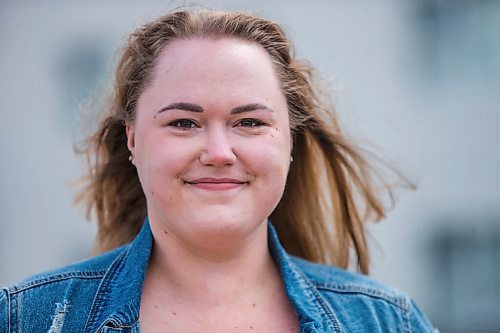 MIKAELA MACKENZIE / WINNIPEG FREE PRESS

Rebecca Driedger, who lives in one of the new high priority neighbourhoods (and is therefore eligible for the vaccine well before she expected to be), poses for a portrait by her apartment building in Winnipeg on Thursday, April 29, 2021. For Malak story.
Winnipeg Free Press 2020.