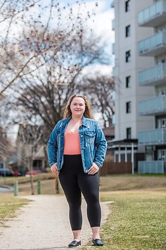 MIKAELA MACKENZIE / WINNIPEG FREE PRESS

Rebecca Driedger, who lives in one of the new high priority neighbourhoods (and is therefore eligible for the vaccine well before she expected to be), poses for a portrait by her apartment building in Winnipeg on Thursday, April 29, 2021. For Malak story.
Winnipeg Free Press 2020.