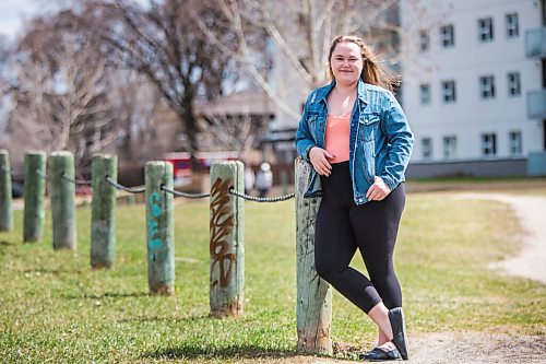 MIKAELA MACKENZIE / WINNIPEG FREE PRESS

Rebecca Driedger, who lives in one of the new high priority neighbourhoods (and is therefore eligible for the vaccine well before she expected to be), poses for a portrait by her apartment building in Winnipeg on Thursday, April 29, 2021. For Malak story.
Winnipeg Free Press 2020.