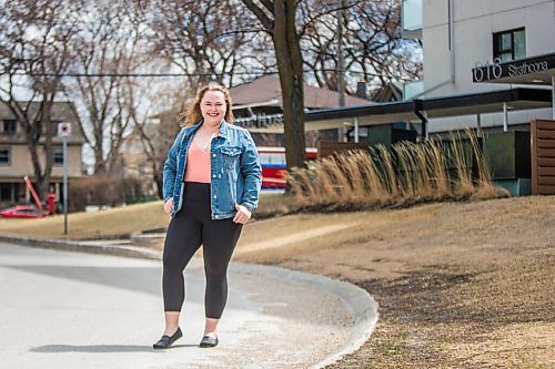 MIKAELA MACKENZIE / WINNIPEG FREE PRESS

Rebecca Driedger, who lives in one of the new high priority neighbourhoods (and is therefore eligible for the vaccine well before she expected to be), poses for a portrait by her apartment building in Winnipeg on Thursday, April 29, 2021. For Malak story.
Winnipeg Free Press 2020.