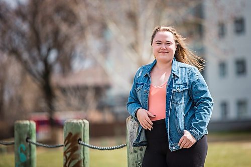 MIKAELA MACKENZIE / WINNIPEG FREE PRESS

Rebecca Driedger, who lives in one of the new high priority neighbourhoods (and is therefore eligible for the vaccine well before she expected to be), poses for a portrait by her apartment building in Winnipeg on Thursday, April 29, 2021. For Malak story.
Winnipeg Free Press 2020.