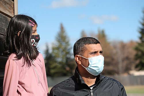 SHANNON VANRAES / WINNIPEG FREE PRESS 
Zahid Abbas and his daughter Kashaf Zahra have been granted permanent resident status in Canada on humanitarian and compassionate grounds. They were photographed near their Winnipeg apartment on April 29, 2021.