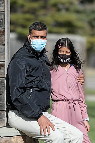 SHANNON VANRAES / WINNIPEG FREE PRESS 
Zahid Abbas and his daughter Kashaf Zahra have been granted permanent resident status in Canada on humanitarian and compassionate grounds. They were photographed near their Winnipeg apartment on April 29, 2021.