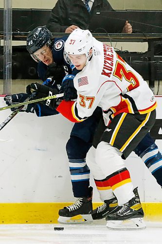 JOHN WOODS / WINNIPEG FREE PRESS
Manitoba Moose Bobby Lynch (46) gets checked by Stockton Heats Yan Kuznetsov (37) during first period AHL action in Winnipeg on Thursday, April 29, 2021.

Reporter: ?