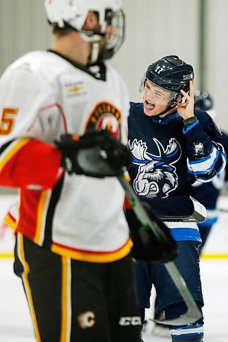 JOHN WOODS / WINNIPEG FREE PRESS
Manitoba Moose Cole Perfetti (17) shows off a shot to the head against the Stockton Heat during first period AHL action in Winnipeg on Thursday, April 29, 2021.

Reporter: ?