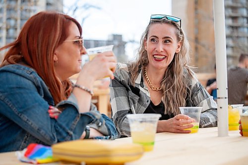 Daniel Crump / Winnipeg Free Press. Charlotte Cook-Dowsett enjoys drinks with her friends at the Beer Can. May 1, 2021.
