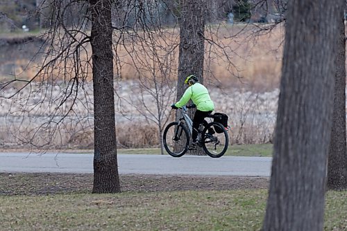 JESSE BOILY  / WINNIPEG FREE PRESS
A cyclist bikes through St. Vital Park on Sunday. Sunday, May 2, 2021.
Reporter: Standup