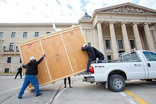 MIKE DEAL / WINNIPEG FREE PRESS
A crew from Total Co-ordination and Construction unloads and installs the Diamond Jubilee Portrait of Her Majesty Queen Elizabeth II which is on a cross country tour while Rideau Hall in Ottawa where it is normally on display undergoes construction. The painting will be in the Manitoba Legislative building room 200 for a year, until May 2022.
The portrait, which is part of the NCCs Crown Collection, was painted on the occasion of Her Majesty Queen Elizabeth IIs Diamond Jubilee by Phil Richards. It was officially unveiled in London, U.K., in 2012, in the presence of The Queen, the Right Honourable David Johnston, then-Governor General of Canada, and the Right Honourable Stephen Harper, then-Prime Minister of Canada. The painting was installed at Rideau Hall on June 28, 2012. That same year, it was the subject of a documentary produced by the National Film Board of Canada to show the various steps involved in creating the portrait and interviews with the artist. 
In late 2018, The Office of the Secretary to the Governor General of Canada (OSGG) announced that the Diamond Jubilee Portrait of Her Majesty Queen Elizabeth II, which has been on display in the Ballroom at Rideau Hall since 2012, would be undertaking a cross-country tour.
Since leaving Rideau Hall in September 2018, the portrait has been on display in St. Johns, N.L., as well as Fredericton, N.B. It will remain on display at the Manitoba Legislative Building until May 2022. Her Majesty will also celebrate Her Platinum Jubilee in 2022, marking 70 years since her accession to the throne.
The portrait will not be on public display until COVID restrictions are lifted, allowing for tours of the building to resume.
210503 - Monday, May 03, 2021.