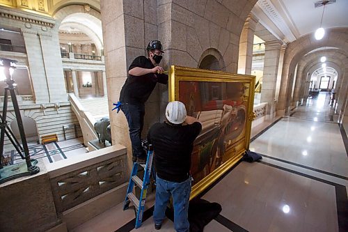 MIKE DEAL / WINNIPEG FREE PRESS
Forman Ryland Warren measures the painting during the installation of the painting. 
A crew from Total Co-ordination and Construction unloads and installs the Diamond Jubilee Portrait of Her Majesty Queen Elizabeth II which is on a cross country tour while Rideau Hall in Ottawa where it is normally on display undergoes construction. The painting will be in the Manitoba Legislative building room 200 for a year, until May 2022.
The portrait, which is part of the NCCs Crown Collection, was painted on the occasion of Her Majesty Queen Elizabeth IIs Diamond Jubilee by Phil Richards. It was officially unveiled in London, U.K., in 2012, in the presence of The Queen, the Right Honourable David Johnston, then-Governor General of Canada, and the Right Honourable Stephen Harper, then-Prime Minister of Canada. The painting was installed at Rideau Hall on June 28, 2012. That same year, it was the subject of a documentary produced by the National Film Board of Canada to show the various steps involved in creating the portrait and interviews with the artist. 
In late 2018, The Office of the Secretary to the Governor General of Canada (OSGG) announced that the Diamond Jubilee Portrait of Her Majesty Queen Elizabeth II, which has been on display in the Ballroom at Rideau Hall since 2012, would be undertaking a cross-country tour.
Since leaving Rideau Hall in September 2018, the portrait has been on display in St. Johns, N.L., as well as Fredericton, N.B. It will remain on display at the Manitoba Legislative Building until May 2022. Her Majesty will also celebrate Her Platinum Jubilee in 2022, marking 70 years since her accession to the throne.
The portrait will not be on public display until COVID restrictions are lifted, allowing for tours of the building to resume.
210503 - Monday, May 03, 2021.