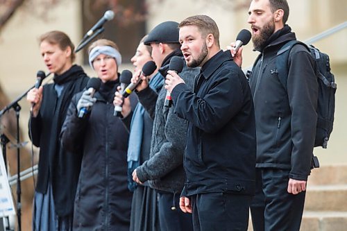 MIKAELA MACKENZIE / WINNIPEG FREE PRESS

Tobias Tissen sings with the Church of God choir at a protest supporting the seven churches fighting pandemic restrictions in court in front of the Law Courts in Winnipeg on Monday, May 3, 2021. For JS story.
Winnipeg Free Press 2020.