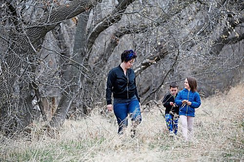 JOHN WOODS / WINNIPEG FREE PRESS
Monica Audette, a recent midwifery graduate, and her children Jude, 6 and Felix, 4, who were both born with the assistance of a midwife, walk in their backyard in Ile des Chenes Monday, May 3, 2021. Audette says that the demand for midwives is huge especially now when women want to have home births and avoid hospitals during COVID-19.

Reporter: Sanders