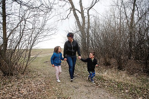 JOHN WOODS / WINNIPEG FREE PRESS
Monica Audette, a recent midwifery graduate, and her children Jude, 6 and Felix, 4, who were both born with the assistance of a midwife, walk in their backyard in Ile des Chenes Monday, May 3, 2021. Audette says that the demand for midwives is huge especially now when women want to have home births and avoid hospitals during COVID-19.

Reporter: Sanders