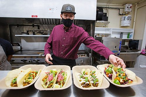 MIKE DEAL / WINNIPEG FREE PRESS
Head chef, Keith Csabak puts the finishing touches on the four tacos that the Beer Can has on the menu right now; from left, The prairie amber quinoa taco, the roasted chicken and refried bean taco, the crispy pork and grilled pineapple salsa taco and the breaded pickerel cheek taco.
The Beer Cantina is a Mexican-inspired food stand offering food made with local ingredients to patrons of the patio. Local chef Keith Csabak is leading the endeavour and there will be more cooks in the kitchen during regular pop-ups. This is a step up from the food truck they partnered with last year.
210504 - Tuesday, May 04, 2021.