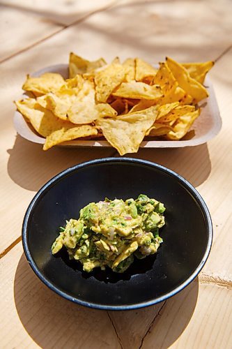 MIKE DEAL / WINNIPEG FREE PRESS
Nachos chips with guacamole.
The Beer Cantina is a Mexican-inspired food stand offering food made with local ingredients to patrons of the patio. Local chef Keith Csabak is leading the endeavour and there will be more cooks in the kitchen during regular pop-ups. This is a step up from the food truck they partnered with last year.
210504 - Tuesday, May 04, 2021.
