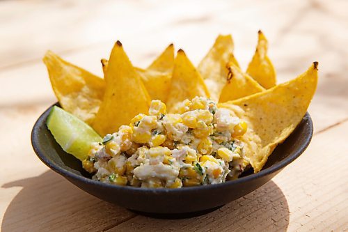 MIKE DEAL / WINNIPEG FREE PRESS
Nachos chips with corn salad.
The Beer Cantina is a Mexican-inspired food stand offering food made with local ingredients to patrons of the patio. Local chef Keith Csabak is leading the endeavour and there will be more cooks in the kitchen during regular pop-ups. This is a step up from the food truck they partnered with last year.
210504 - Tuesday, May 04, 2021.