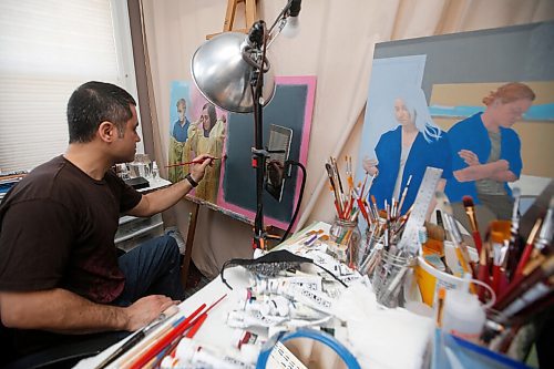 JOHN WOODS / WINNIPEG FREE PRESS
Clinton Roberts, a self taught artist who works at the patient transport department at the Health Sciences Centre, is photographed in his small home studio with some of the portraits he has painted of his co-workers Wednesday, May 5, 2021. 

Reporter: Wasney
