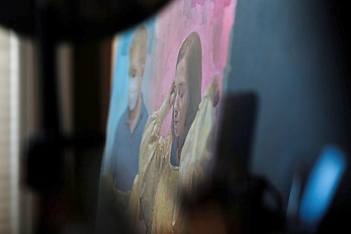 JOHN WOODS / WINNIPEG FREE PRESS
Clinton Roberts, a self taught artist who works at the patient transport department at the Health Sciences Centre, is photographed in his small home studio with some of the portraits he has painted of his co-workers Wednesday, May 5, 2021. 

Reporter: Wasney
