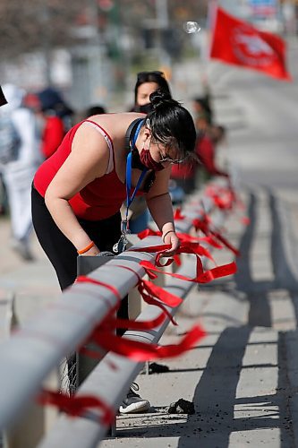 JOHN WOODS / WINNIPEG FREE PRESS
People gather to remember Murdered and Missing Indigenous Women and Girls (MMIWG) at the corner of Salter and Dufferin and to tie ribbons with names of MMIWG on the Slaw Rebchuck Bridge Wednesday, May 5, 2021. 

Reporter: ?
