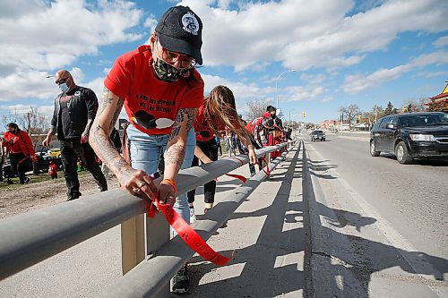 JOHN WOODS / WINNIPEG FREE PRESS
People gather to remember Murdered and Missing Indigenous Women and Girls (MMIWG) at the corner of Salter and Dufferin and to tie ribbons with names of MMIWG on the Slaw Rebchuck Bridge Wednesday, May 5, 2021. 

Reporter: ?
