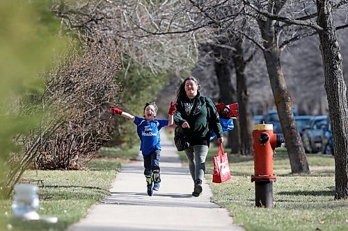 JOHN WOODS / WINNIPEG FREE PRESS
Kisa MacIsaac, an early childhood educator and mother of three, walks with her son Kalvin to his soccer game Wednesday, May 5, 2021. MacIsaac works in a daycare full-time and with three children has had a difficult time maintaining a balance during the pandemic.

Reporter: Wasney
