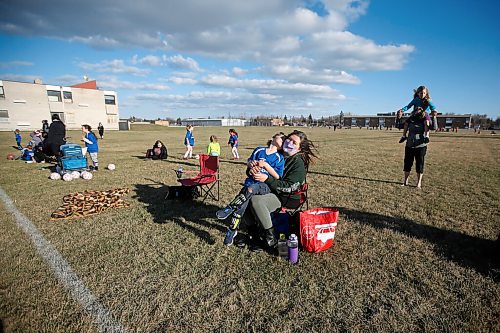 JOHN WOODS / WINNIPEG FREE PRESS
Kisa MacIsaac, an early childhood educator and mother of three, spends time with her son Kalvin at his soccer game Wednesday, May 5, 2021. MacIsaac works in a daycare full-time and with three children has had a difficult time maintaining a balance during the pandemic.

Reporter: Wasney
