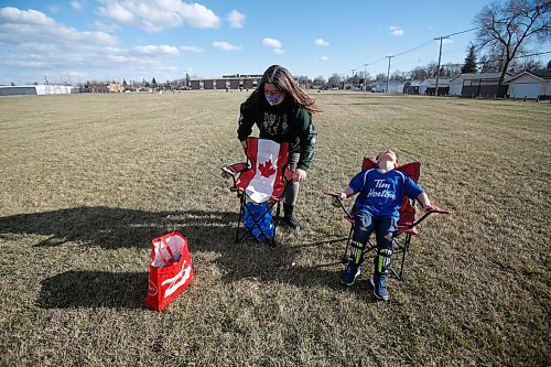 JOHN WOODS / WINNIPEG FREE PRESS
Kisa MacIsaac, an early childhood educator and mother of three, sets up chairs with her son Kalvin at his soccer game Wednesday, May 5, 2021. MacIsaac works in a daycare full-time and with three children has had a difficult time maintaining a balance during the pandemic.

Reporter: Wasney
