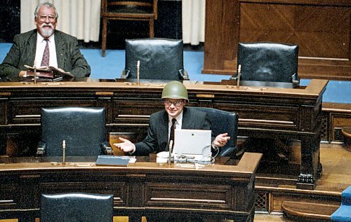 Ken Gigliotti / Winnipeg Free Press files
November 27, 1996
Kevin Lamoureux a Liberal who occupies a seat in the middle ground between the aring NDP and Conservatives felt he needed head protection of a military helmet which he brought to the legislative chamber. He did not wear it during the session but did put it on inside the chamber during a break. Wearing head covers in the chamber during session is prohibited.