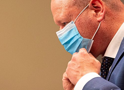 MIKE SUDOMA / WINNIPEG FREE PRESS  
Dr Brent Roussin tightens a disposable mask after announcing a tighter set of restrictions to prevent the spread of Covid 19 during a press conference at the Manitoba Legislative Building Friday evening
April 22, 2021