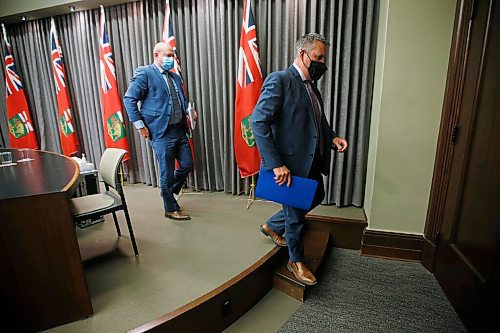 JOHN WOODS / WINNIPEG FREE PRESS
Manitoba Education Minister Cliff Cullen, right, and Dr. Brent Roussin, chief provincial public health officer leave a COVID-19 press conference at the Manitoba Legislature in Winnipeg Sunday, May 9, 2021. Additional COVID-19 measures for schools including closures were announced.

Reporter: Durrani