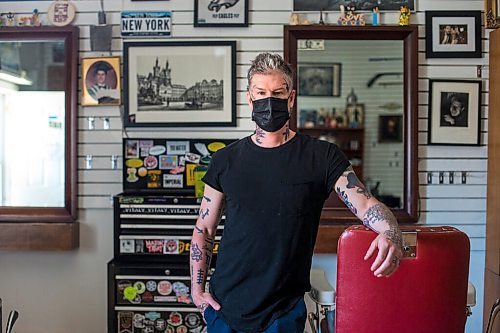 MIKAELA MACKENZIE / WINNIPEG FREE PRESS

Jeremy Regan, owner of Hunter & Gunn, poses for a portrait in front of the shuttered barbershop in Winnipeg on Monday, May 10, 2021. For Temur story.
Winnipeg Free Press 2020.