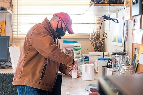 MIKAELA MACKENZIE / WINNIPEG FREE PRESS

Roger Stearns prepares formula for the cub at the black bear rehabilitation centre near Stonewall on Sunday, April 25, 2021. For Eva Wasney story.
Winnipeg Free Press 2020.