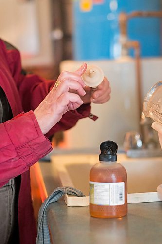 MIKAELA MACKENZIE / WINNIPEG FREE PRESS

Judy Stearns puts honey on the nipple to make it more appealing to the cub at the black bear rehabilitation centre near Stonewall on Sunday, April 25, 2021. For Eva Wasney story.
Winnipeg Free Press 2020.