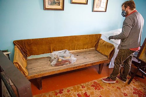 MIKE DEAL / WINNIPEG FREE PRESS
The oldest made in Manitoba couch that is in need of reupholstering made by John Inkster from oak some time between 1853 and 1880.
Eric Napier Strong, curator and manager of the Seven Oaks House Museum (50 Mac Street) during a behind the scenes look at some of the rarely seen artifacts in Winnipeg's oldest home turned museum.
See Brenda Suderman story
210511 - Tuesday, May 11, 2021.