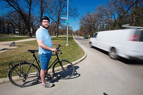 MIKE DEAL / WINNIPEG FREE PRESS
Cyclist Zach Fleisher on his bike at the intersection of Wellington Crescent and Guelph Street, wants enhanced summer cycling routes open as soon as possible and is concerned with current wait for them.
See Joyanne Pursaga story
210512 - Wednesday, May 12, 2021.