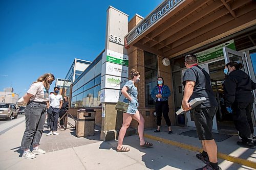 MIKAELA MACKENZIE / WINNIPEG FREE PRESS

Sisters Sophie (left) and Anica Warkentine walk in to get vaccinated at the Ma Mawi Wi Chi Itata Centre walk-in clinic on the day that eligibility expanded to include all Manitobans over the age of 18 in Winnipeg on Wednesday, May 12, 2021. For Malak story.
Winnipeg Free Press 2020.