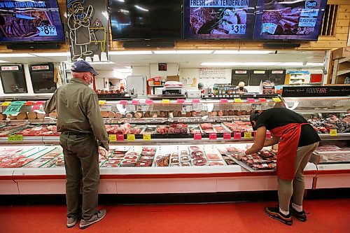JOHN WOODS / WINNIPEG FREE PRESS
Michael Asgodom, right, stocks the meat at the deli counter at Food Fare on Portage Ave in Winnipeg Wednesday, May 12, 2021. Despite the pandemic and high prices meat is in high demand.

Reporter: Durrani