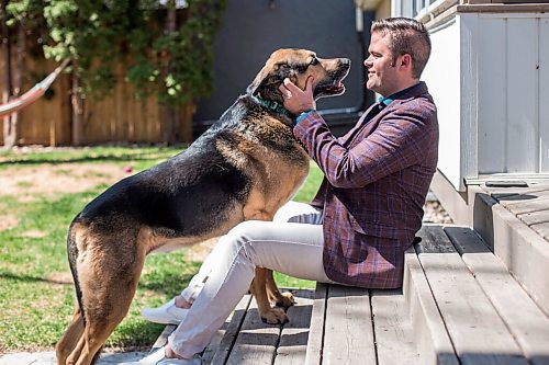 MIKAELA MACKENZIE / WINNIPEG FREE PRESS

Johanu Botha, co-lead of Manitoba's vaccine implementation task force, poses for a portrait with his dog, Gandalf, at his home in Winnipeg on Thursday, May 13, 2021. For Dylan story.
Winnipeg Free Press 2020.