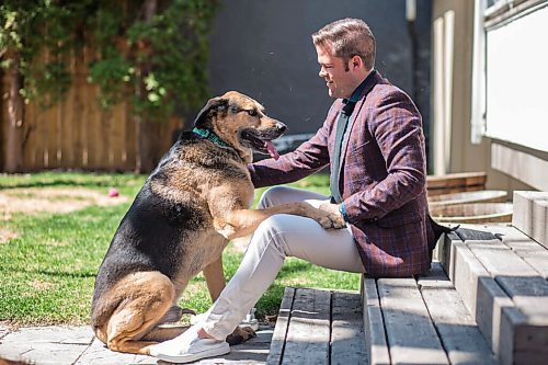 MIKAELA MACKENZIE / WINNIPEG FREE PRESS

Johanu Botha, co-lead of Manitoba's vaccine implementation task force, poses for a portrait with his dog, Gandalf, at his home in Winnipeg on Thursday, May 13, 2021. For Dylan story.
Winnipeg Free Press 2020.