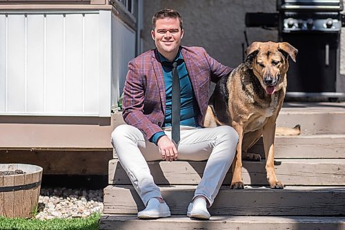 MIKAELA MACKENZIE / WINNIPEG FREE PRESS

Johanu Botha, co-lead of Manitoba's vaccine implementation task force, poses for a portrait with his dog, Gandalf, at his home in Winnipeg on Thursday, May 13, 2021. For Dylan story.
Winnipeg Free Press 2020.