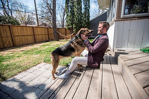 MIKAELA MACKENZIE / WINNIPEG FREE PRESS

Johanu Botha, co-lead of Manitoba's vaccine implementation task force, poses for a portrait with his dog, Gandalf, at his home in Winnipeg on Thursday, May 13, 2021. For Dylan story.
Winnipeg Free Press 2020.