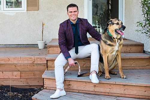 MIKAELA MACKENZIE / WINNIPEG FREE PRESS

Johanu Botha, co-lead of Manitoba's vaccine implementation task force, poses for a portrait with his dog, Gandalf, at his home in Winnipeg on Thursday, May 13, 2021. For Dylan story.
Winnipeg Free Press 2020.