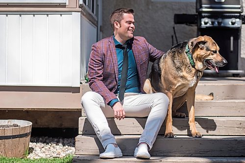 MIKAELA MACKENZIE / WINNIPEG FREE PRESS

Johanu Botha, co-lead of Manitoba's vaccine implementation task force, poses for a portrait with his dog, Gandalf, at his home in Winnipeg on Thursday, May 13, 2021. For Dylan story.
Winnipeg Free Press 2020.