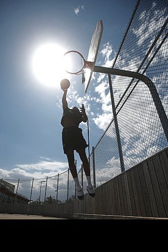 Emmanuel Ugbah, an elite high school basketball player who is heading to Carlton University next year, practices at his local community centre in Winnipeg, Thursday, May 13, 2021. Many elite high school athletes have lost a year of playing and development due to COVID-19 pandemic restrictions. THE CANADIAN PRESS/John Woods