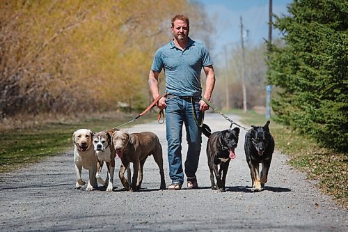 MIKE DEAL / WINNIPEG FREE PRESS
Yury Harczan a professional dog trainer who trained Anita Hart's service dog. Yury lives on six acres and has his own pack of dogs.
From left; Ecko, Chewy, Grizz, Tux, and Chops.
See Sabrina Carnevale story
210513 - Thursday, May 13, 2021.